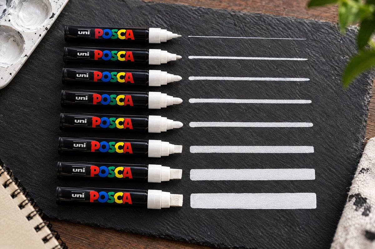 POSCA white markers in every tip size with test strokes