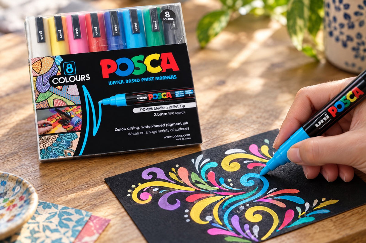 POSCA markers drawing decorative lettering flourishes
