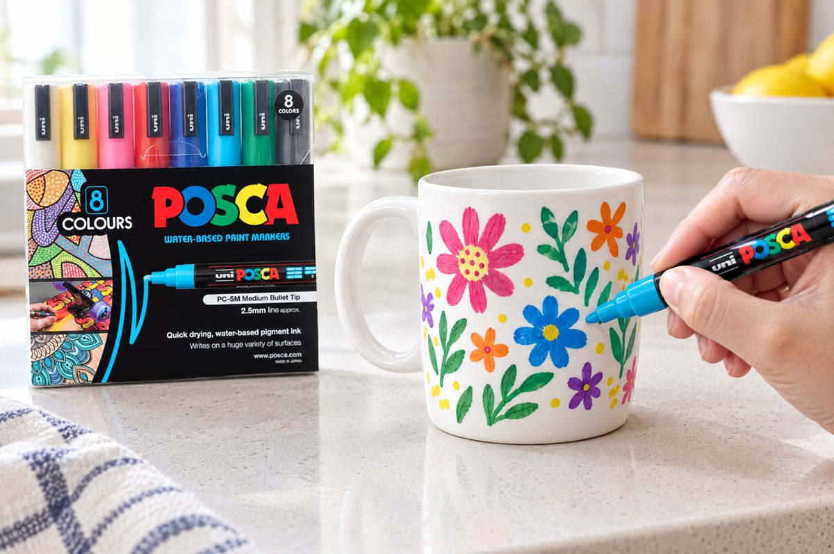 POSCA PC-5M markers decorating a white ceramic mug