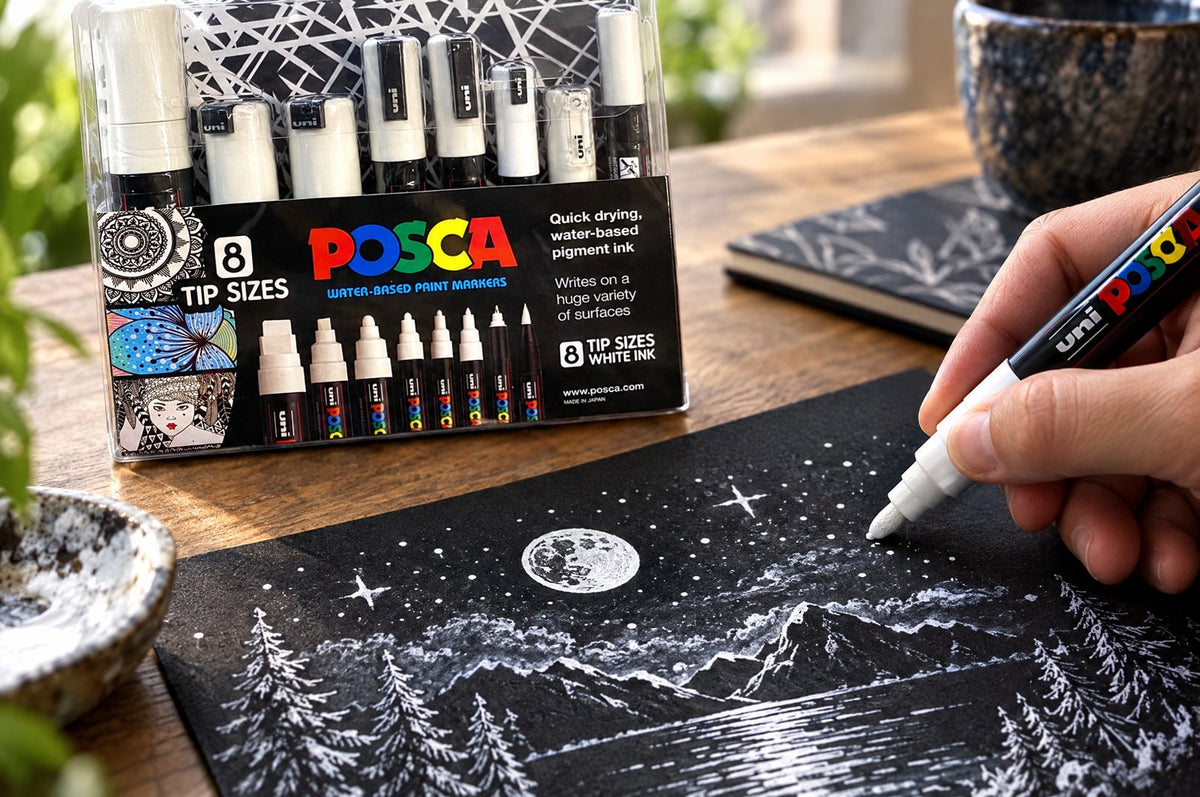 POSCA white marker adding highlights on dark card
