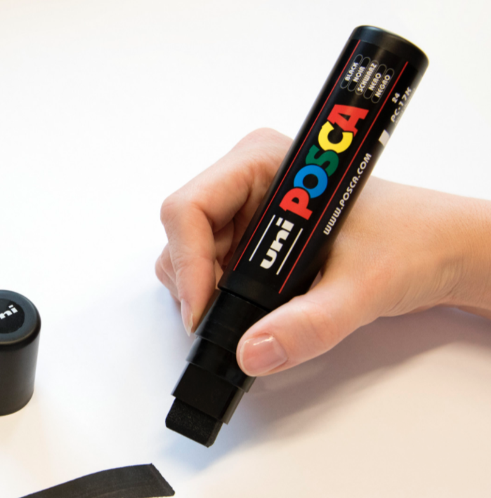 Artist covering a large area with a POSCA PC-17K marker