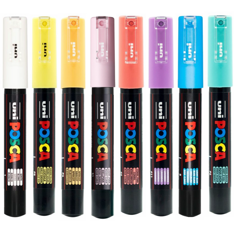 The eight POSCA PC-1M pastel markers uncapped showing the extra fine tips