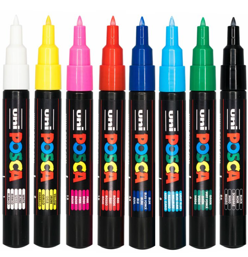 The eight POSCA PC-1M markers laid flat showing the colours