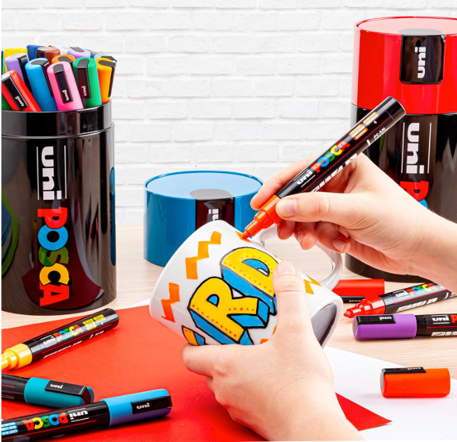 POSCA PC-5M markers from the gift tin in use