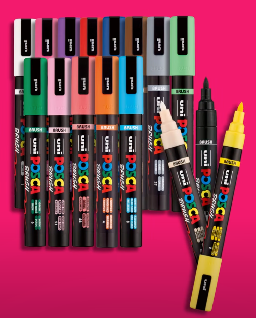 POSCA PC-5BR brush markers on a pink background with brush tips exposed