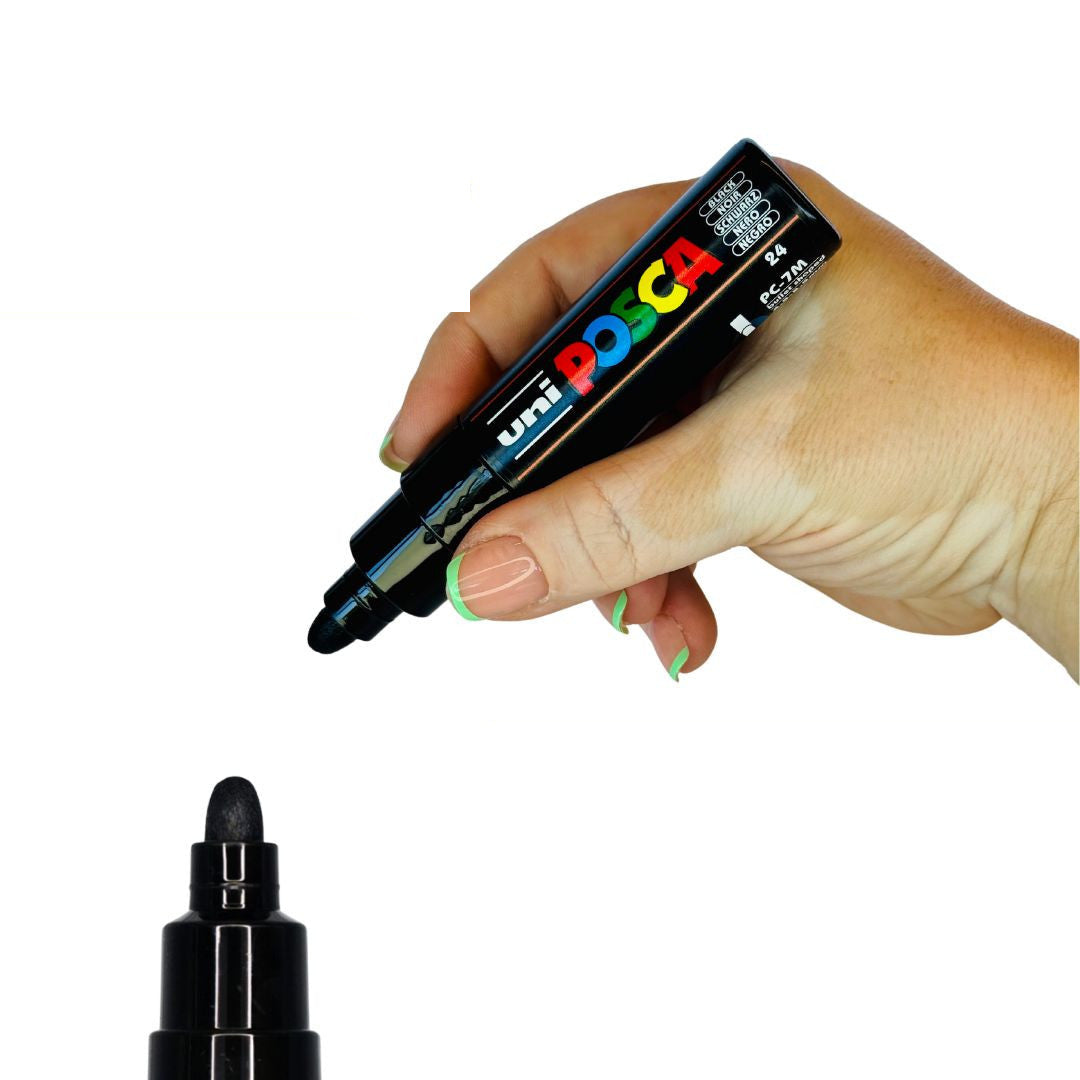 POSCA PC-7M broad 4.5 to 5.5mm bullet tip paint marker held in hand, 15 colours available at PoscART