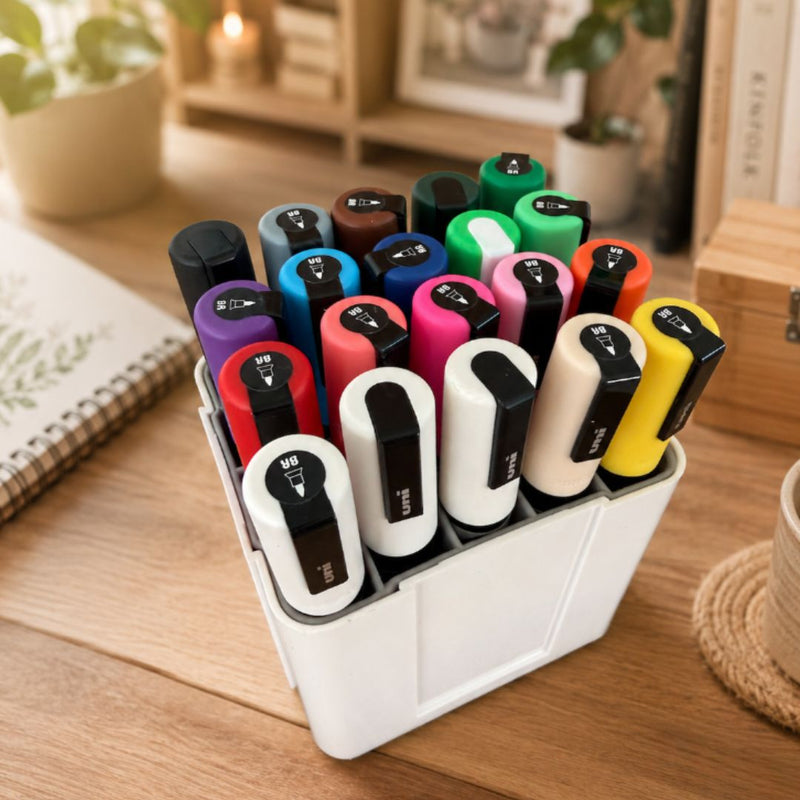 Deflecto interlocking marker organiser with POSCA markers on a wooden desk