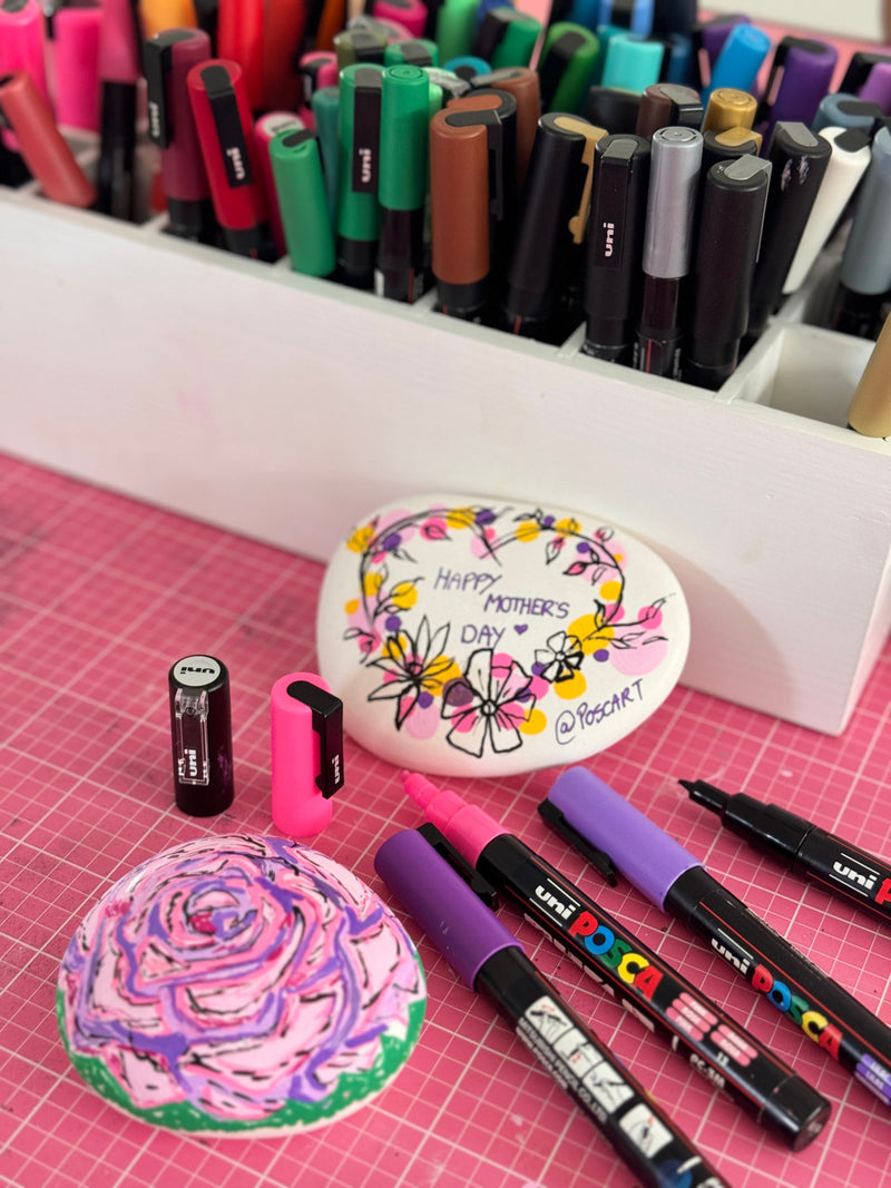 Pebble art examples decorated with POSCA PC-5M markers