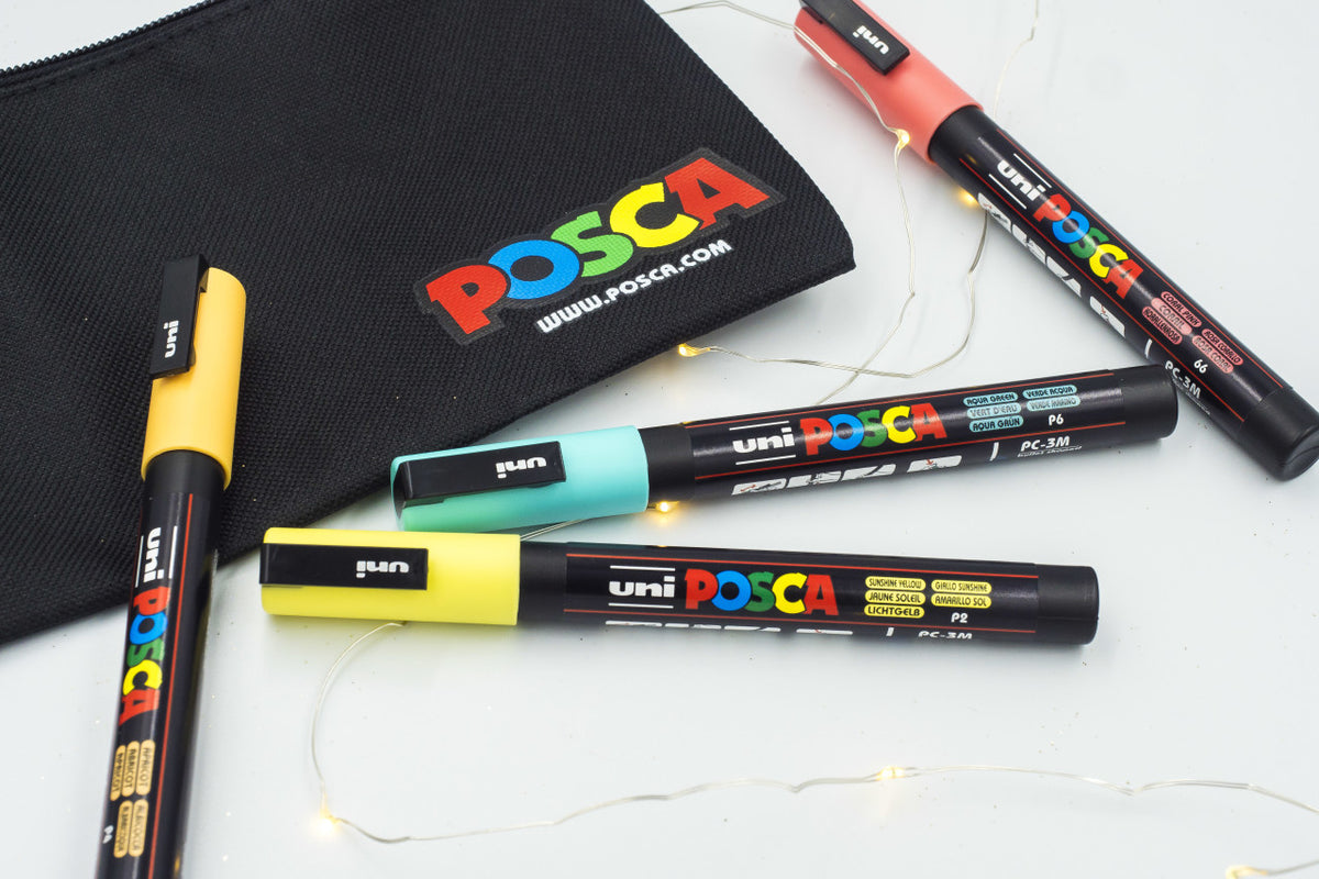 The black POSCA canvas bag and four PC-3M markers from the Creativity on Canvas bundle laid out