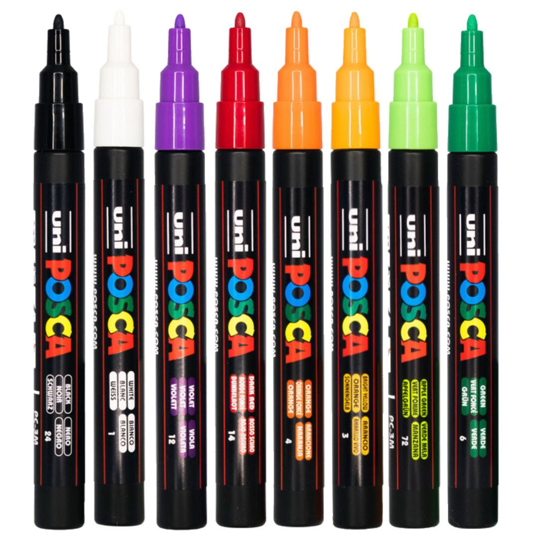 Eight POSCA PC-3M Halloween tone markers uncapped showing the bullet tips