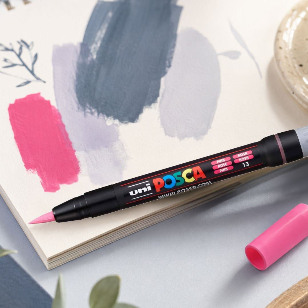 POSCA PCF-350 pink brush marker on a sketchbook with swatches