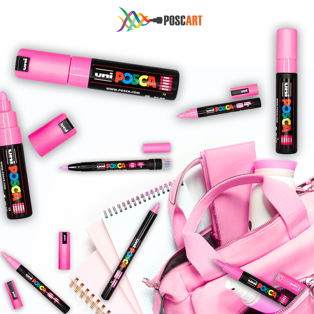 POSCA pink 8 tip set in a flat lay with stationery on a white background