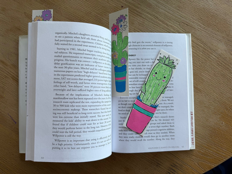POSCA colour-in bookmarks cactus theme, potted cactus designs in pastel green and pink on an open book