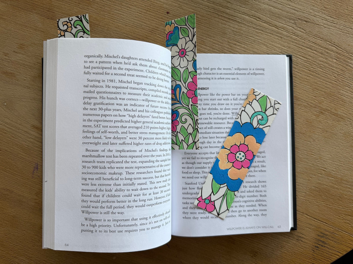 POSCA colour-in bookmarks mandala theme, detailed floral mandala patterns on open book pages