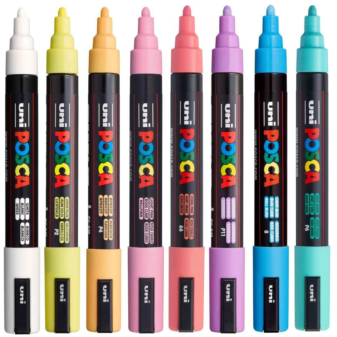 POSCA PC-5M pastel markers uncapped standing upright showing the eight colours